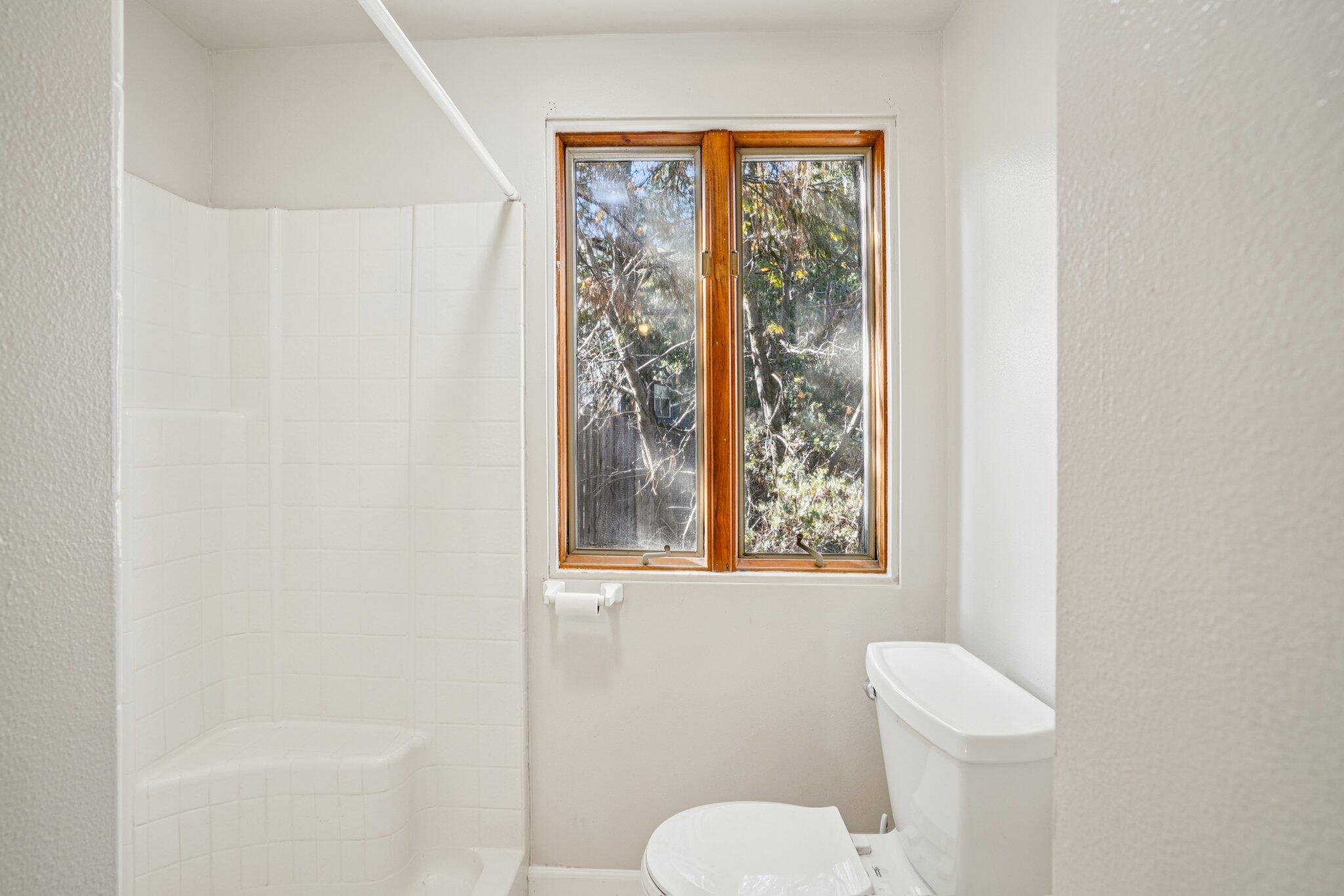 53451 Middleridge Drive Idyllwild, CA 92549 - Photo 18 of 29 a white toilet sitting next to a bathroom sink