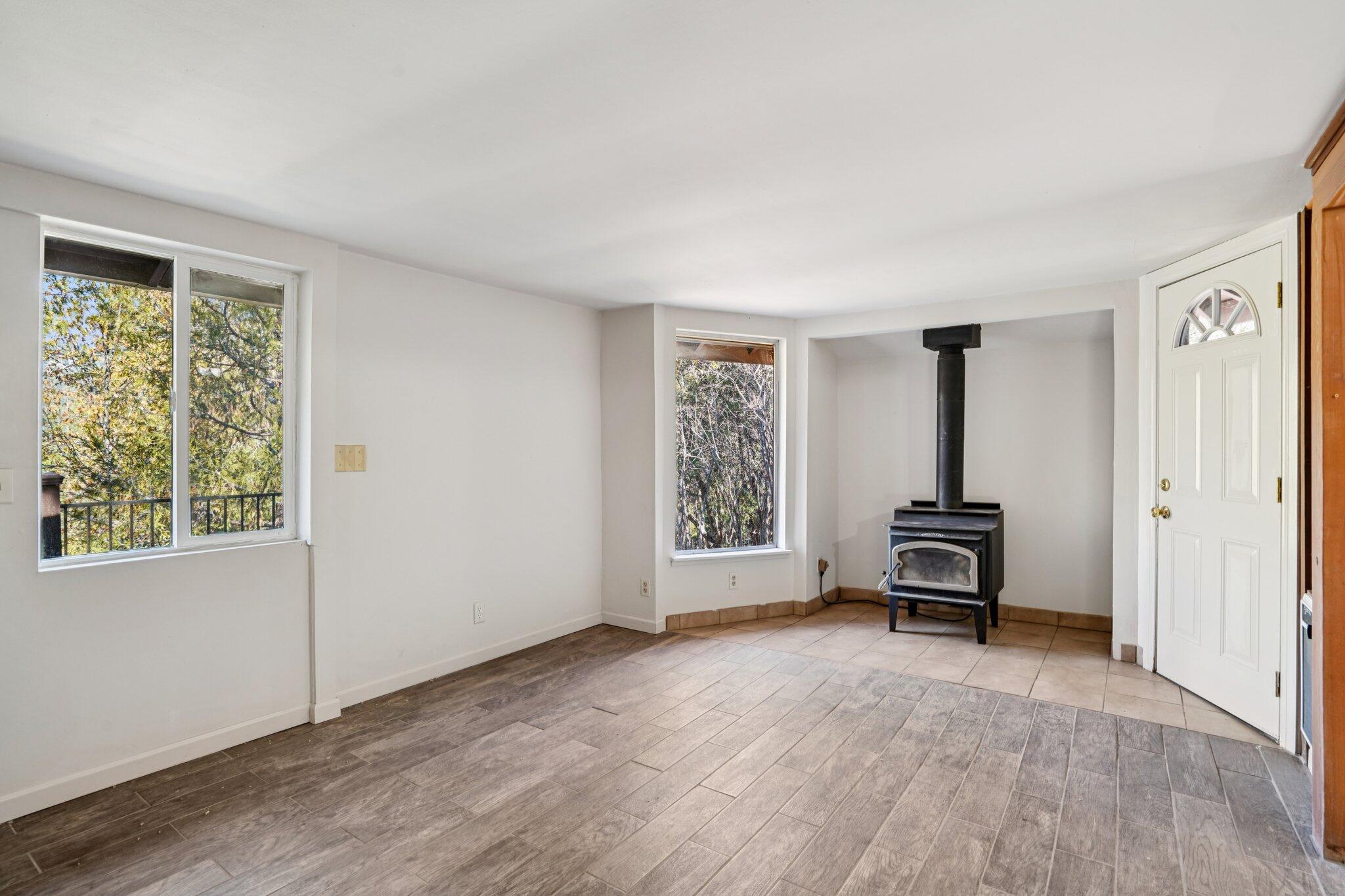 53451 Middleridge Drive Idyllwild, CA 92549 - Photo 5 of 29 a view of room with window and wooden floor
