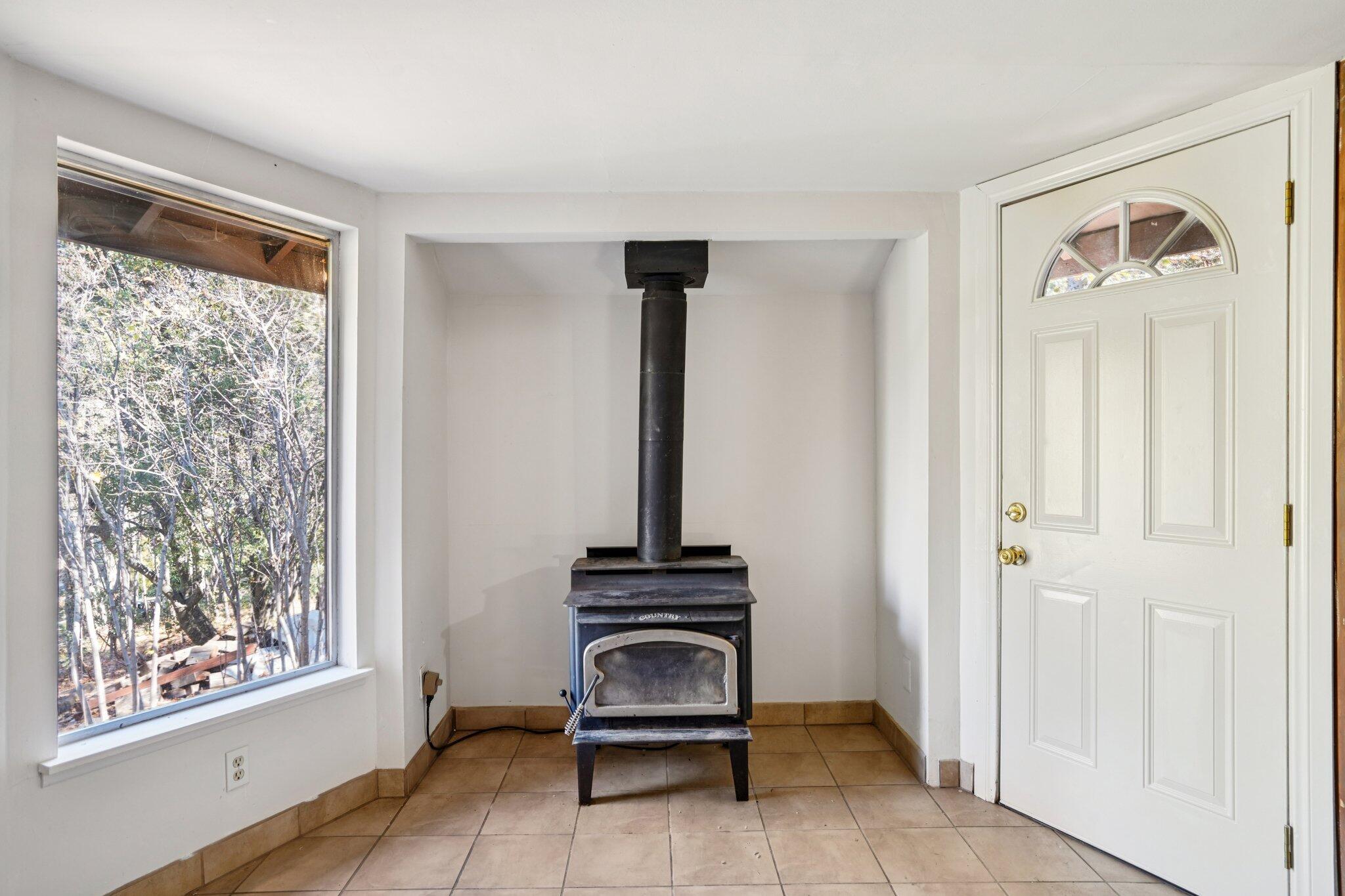 53451 Middleridge Drive Idyllwild, CA 92549 - Photo 6 of 29 a view of a livingroom with shelves and a entryway