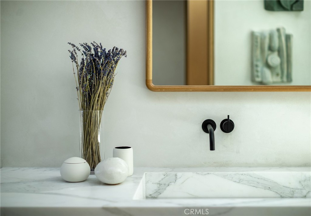 2910 Lafayette Avenue Newport Beach, CA 92663 - Photo 38 of 60 a bathroom with a sink and a mirror