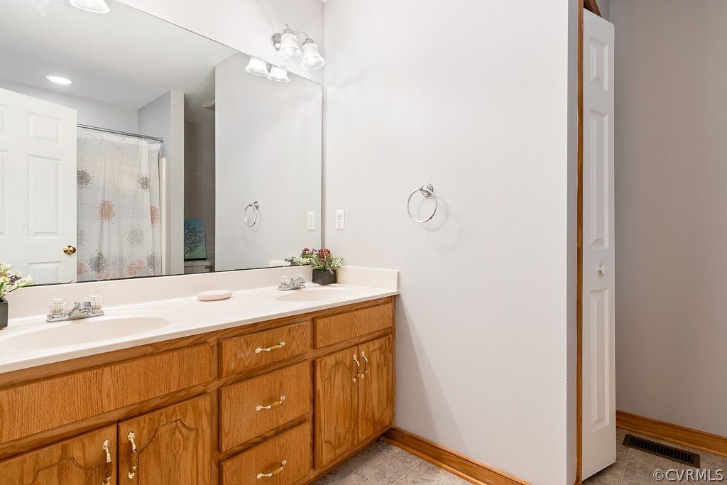19160 Halifax Road Carson, VA 23830 - Photo 19 of 30 a bathroom with a sink and a mirror