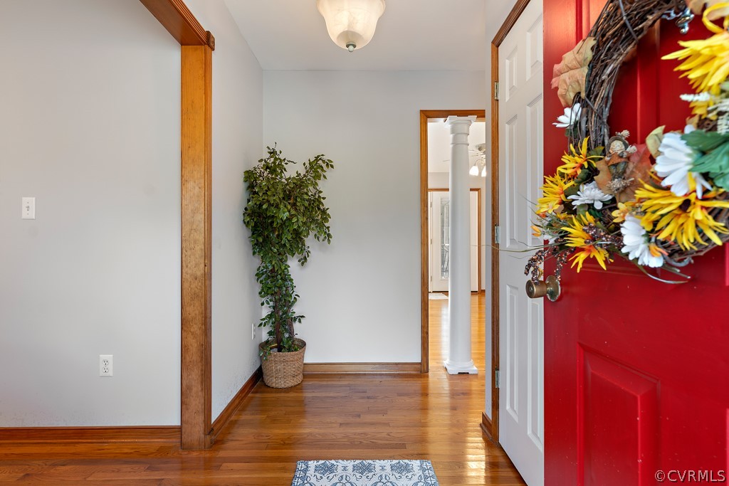 19160 Halifax Road Carson, VA 23830 - Photo 3 of 30 a view of a hallway with wooden floor and a potted plant