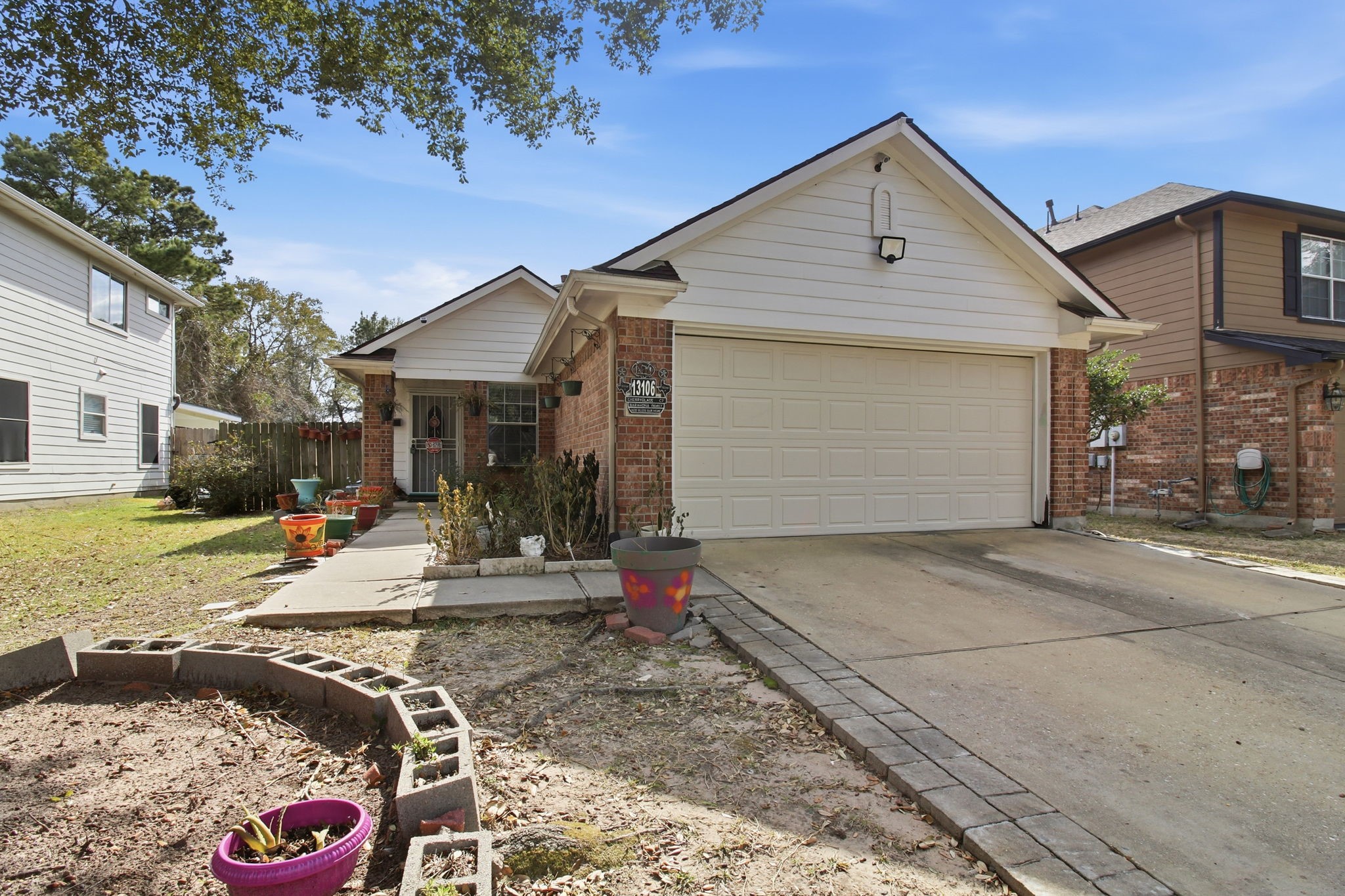 13106 Cherryglade Court Houston, TX 77044 - Photo 2 of 26 a view of the house with backyard