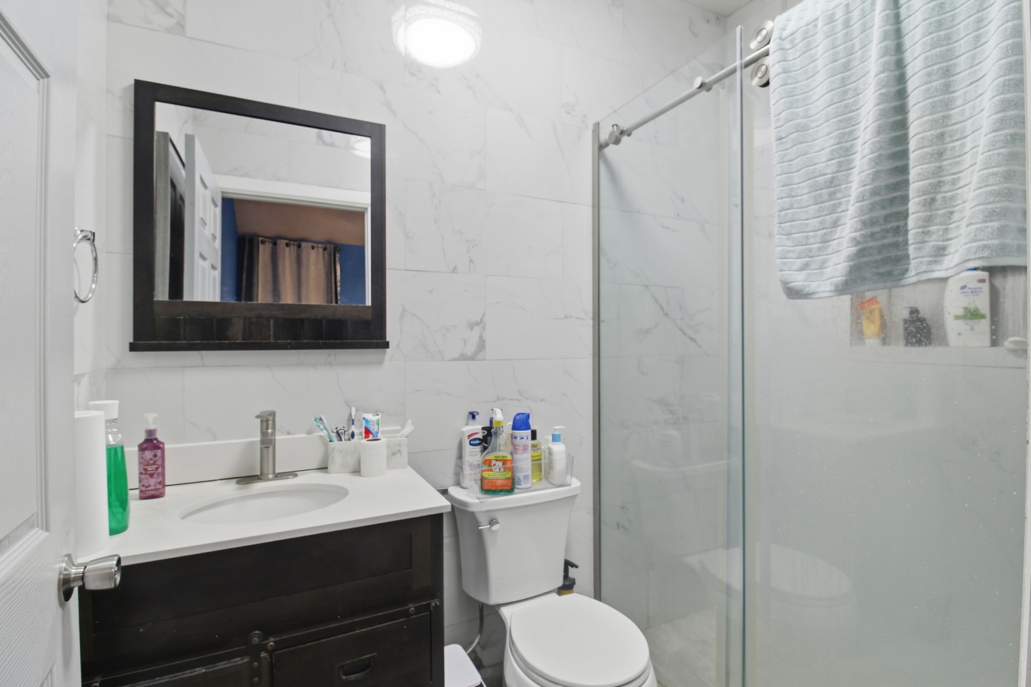13106 Cherryglade Court Houston, TX 77044 - Photo 22 of 26 a bathroom with a sink vanity mirror and toilet