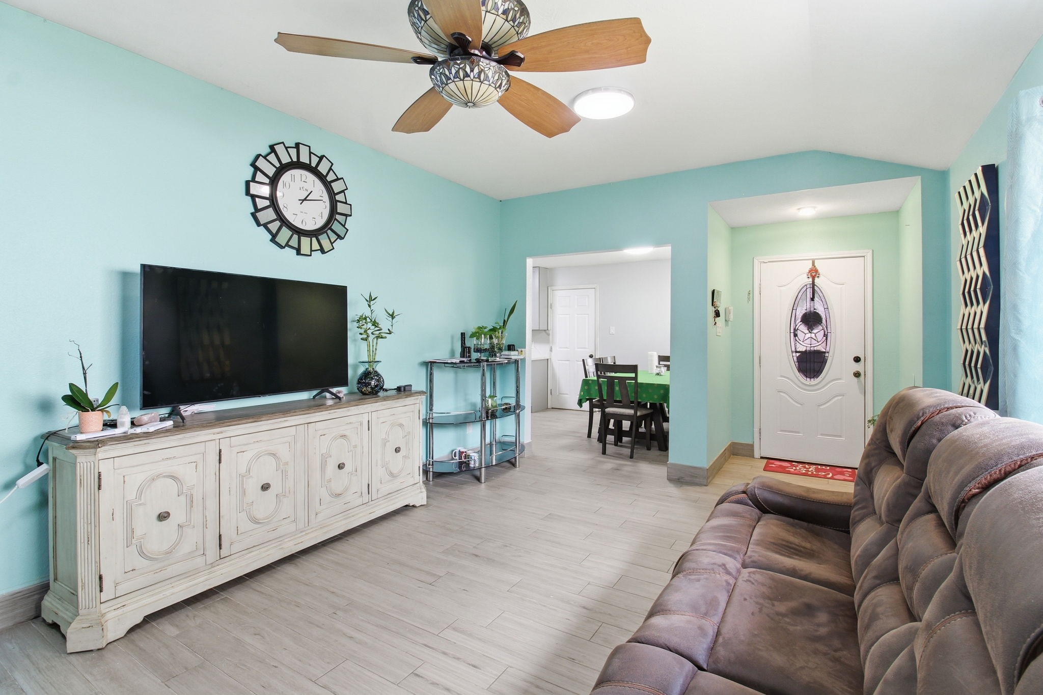 13106 Cherryglade Court Houston, TX 77044 - Photo 24 of 26 a living room with furniture and a flat screen tv