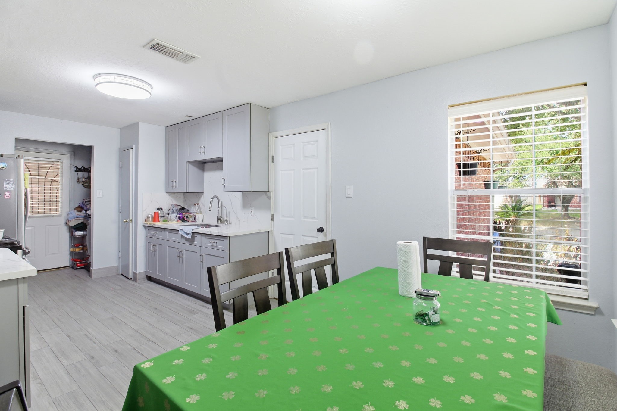 13106 Cherryglade Court Houston, TX 77044 - Photo 7 of 26 a living room with kitchen island furniture and a open kitchen view
