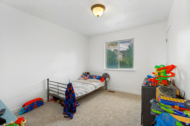 1585 South 910 West Payson, UT 84651 - Photo 20 of 32 White walls with light-colored carpet flooring