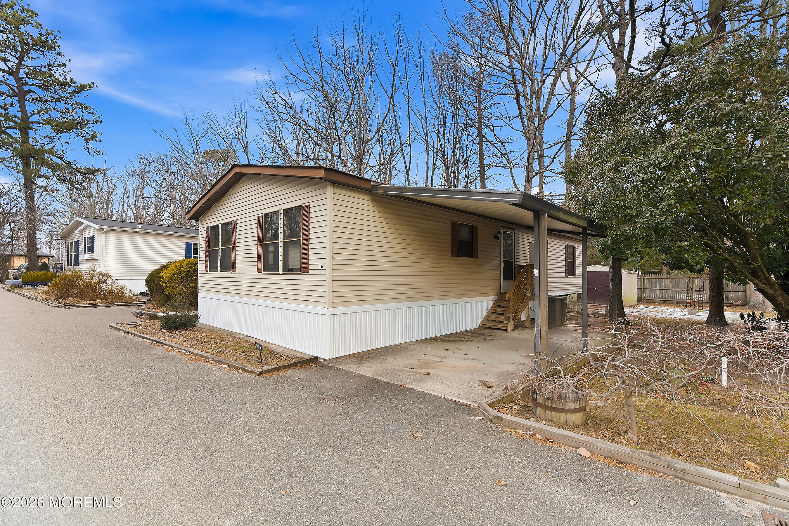 6 Loblolly Lane Jackson, NJ 08527 - Photo 2 of 20 a front view of a house with a yard