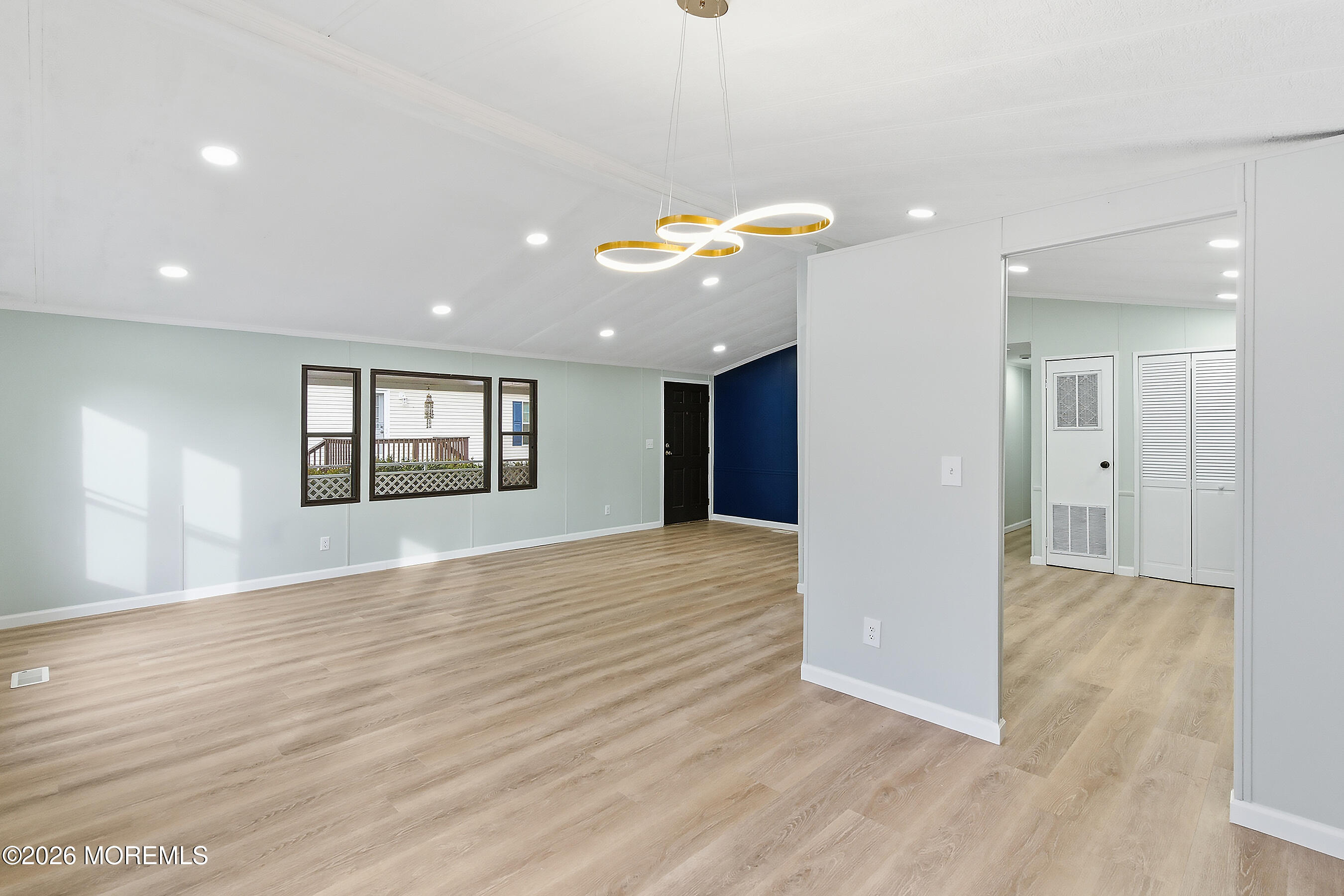 6 Loblolly Lane Jackson, NJ 08527 - Photo 10 of 20 an empty room with wooden floor and windows