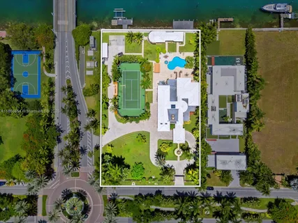an aerial view of residential house with outdoor space and swimming pool