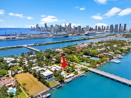 an aerial view of a house with a swimming pool yard and outdoor seating