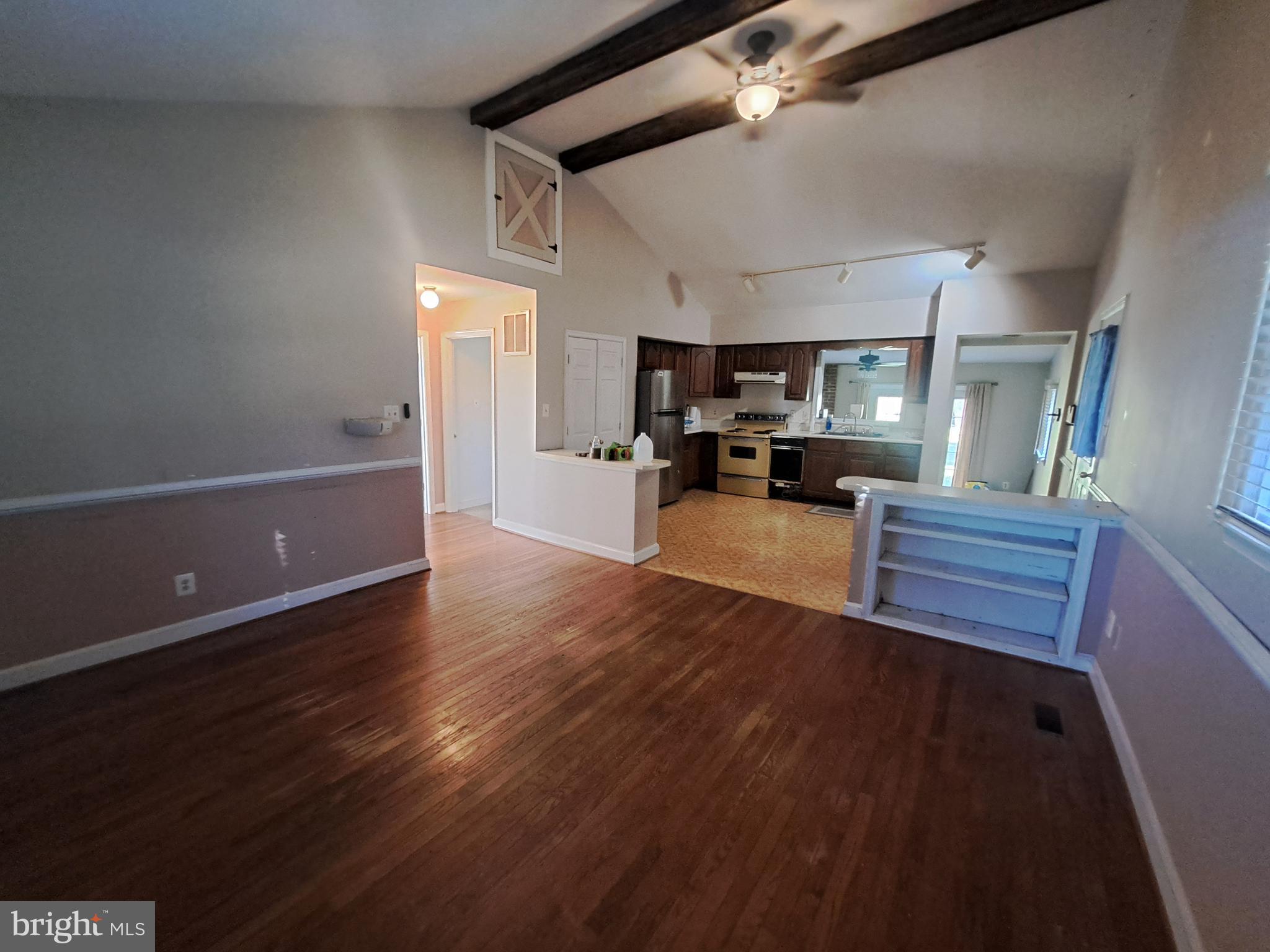 24401 River Road Dickerson, MD 20842 - Photo 30 of 43 a kitchen with sink cabinets and wooden floor