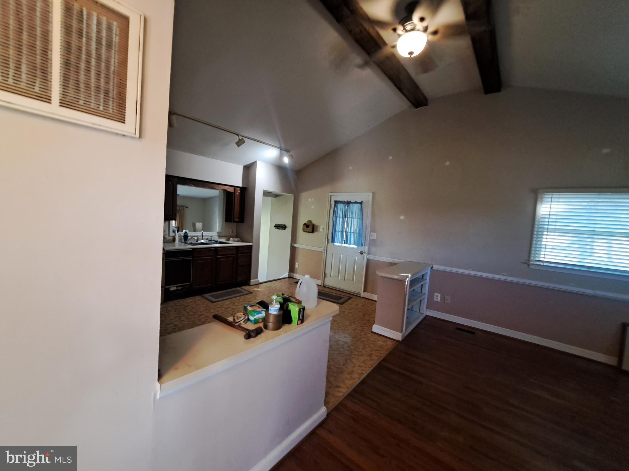 24401 River Road Dickerson, MD 20842 - Photo 33 of 43 a living room with furniture and a wooden floor
