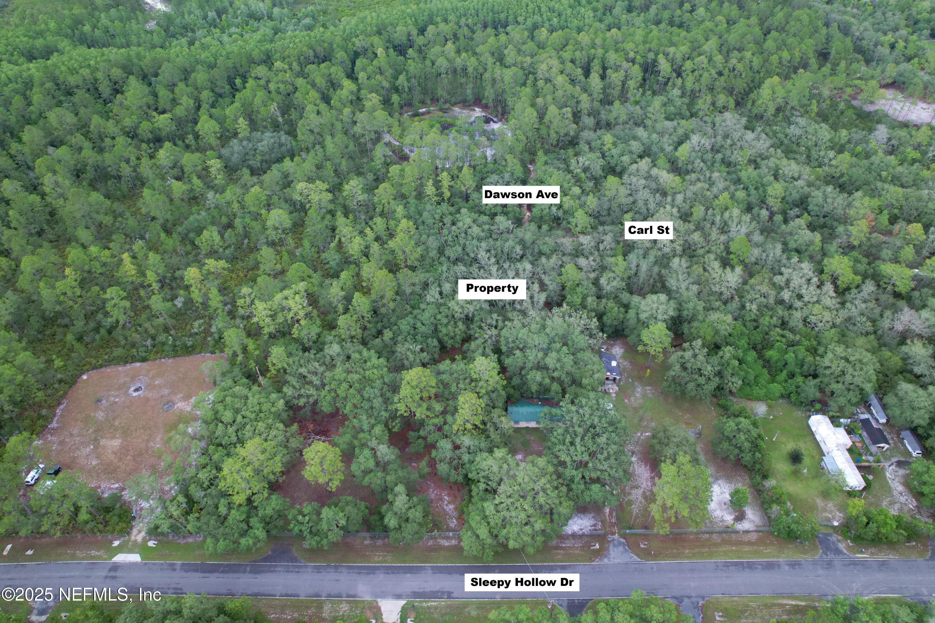 143 Dawson Avenue Interlachen, FL 32148 - Photo 5 of 15 an aerial view of a house with a yard