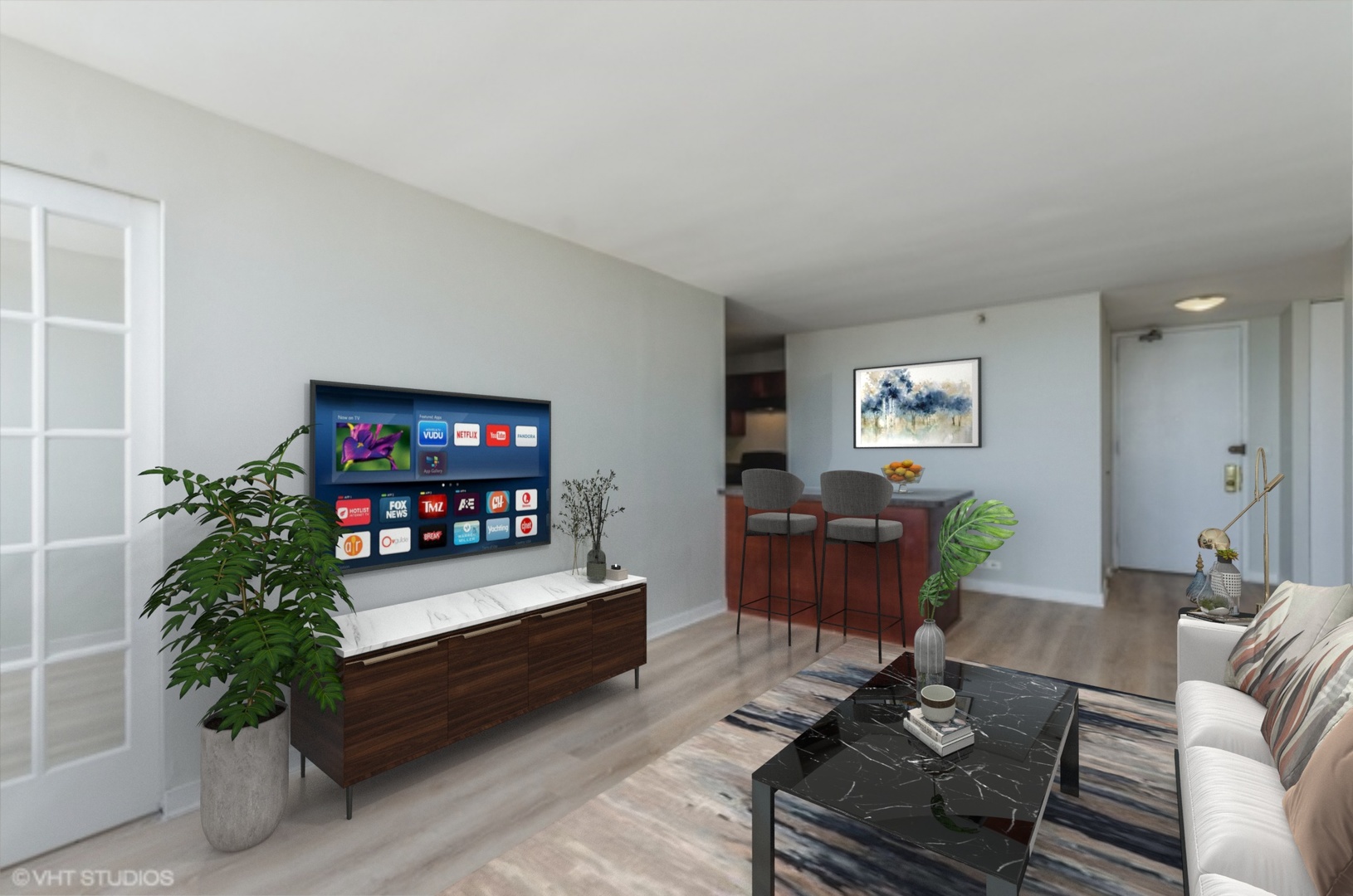 655 West Irving Park Road, Unit 3006 Chicago, IL 60613 - Photo 3 of 23 a living room with furniture and a flat screen tv