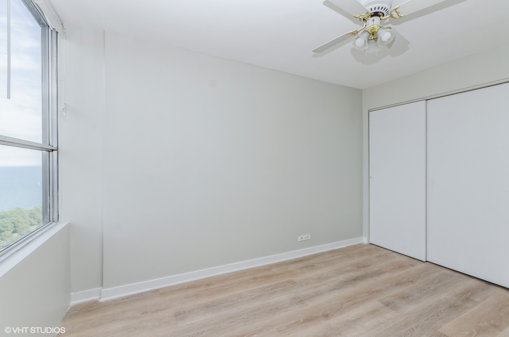 655 West Irving Park Road, Unit 3006 Chicago, IL 60613 - Photo 8 of 23 a view of an empty room with a window