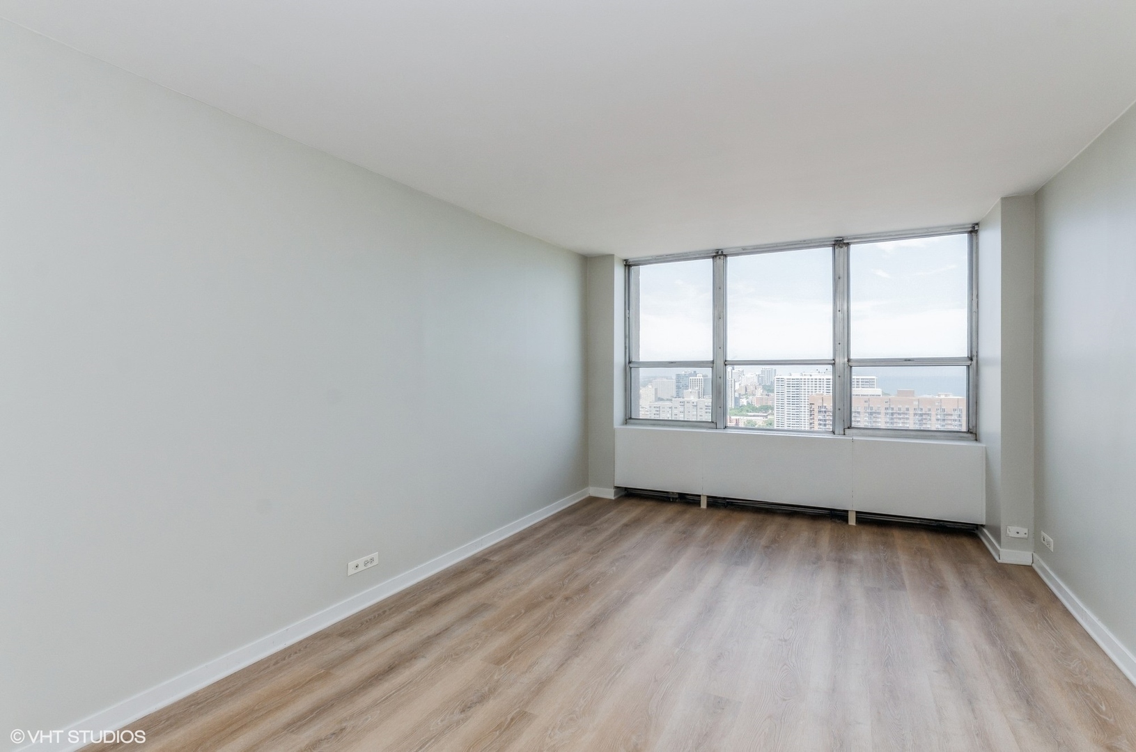 655 West Irving Park Road, Unit 3006 Chicago, IL 60613 - Photo 9 of 23 a view of an empty room with a window