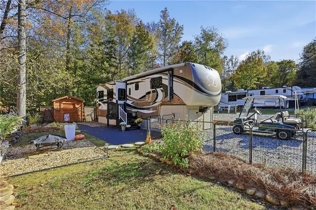 an aerial view of a house with garden space and sitting area