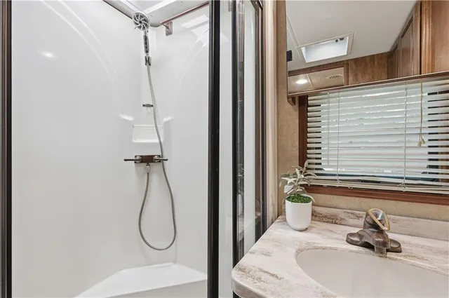 a bathroom with a sink and a shower