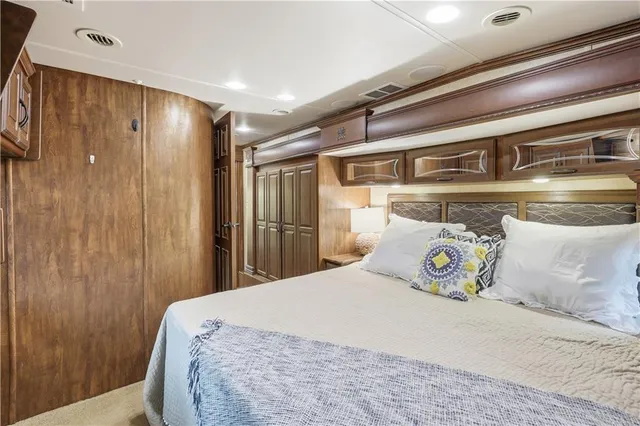 a bedroom with a bed and a table