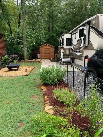 a house view with a sitting space and garden