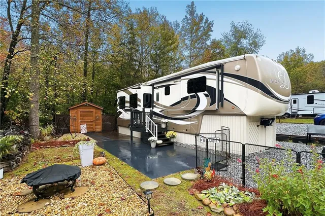 a front view of a house with garden equipment