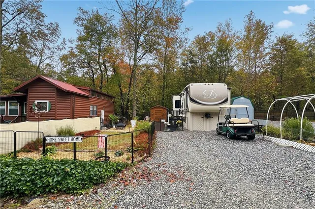 a view of a house with a sink and a backyard