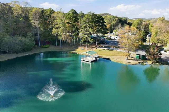 a swimming pool with outdoor seating and yard