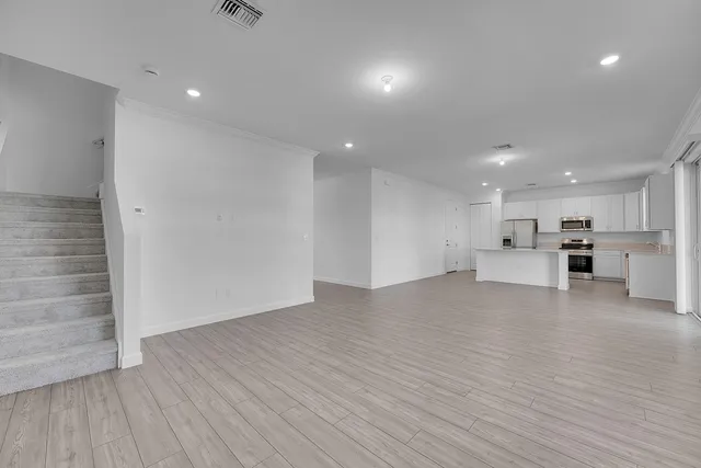 a view of kitchen with wooden floor