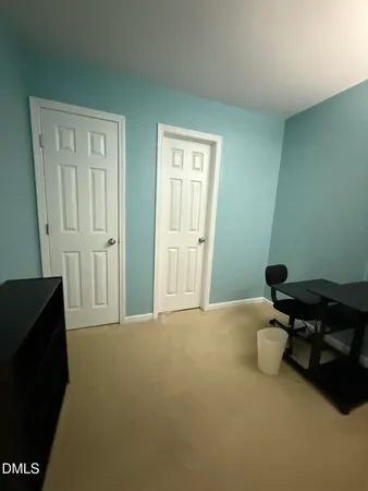 a room that has a dresser and a chair in it