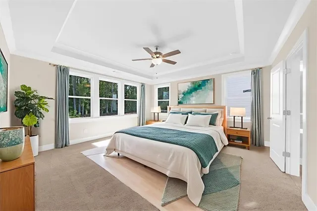 a spacious bedroom with a large bed and a window