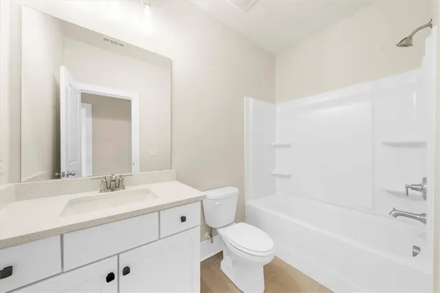 a bathroom with a sink a toilet and a bathtub