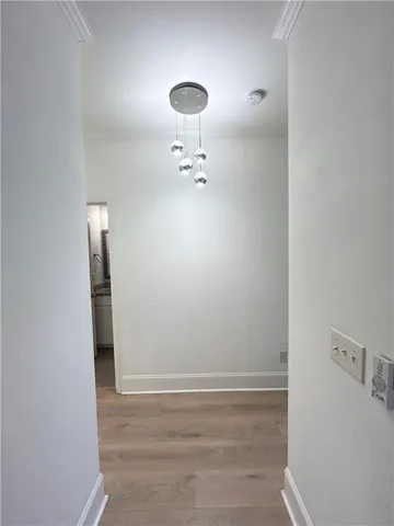 a bathroom with a light fixture and a sink