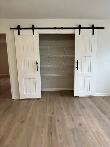 a view of wooden floor with entryway