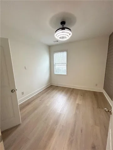 a front view of a house with a yard covered in snow