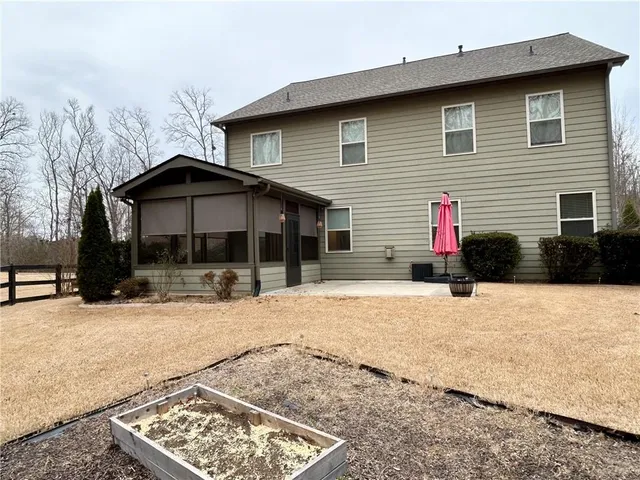 a view of a house with a yard and garage