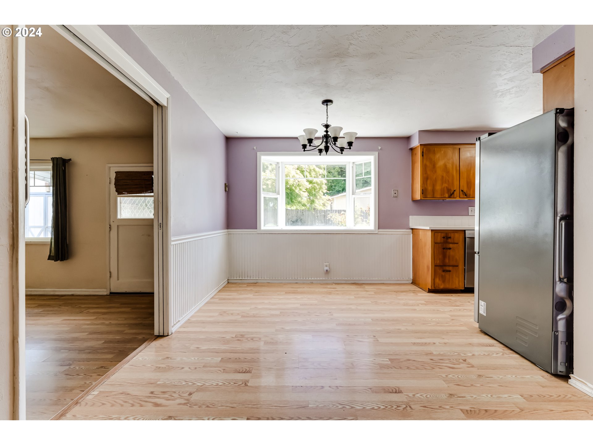 4115 Scottdale Street Eugene, OR 97404 - Photo 11 of 33 a view interior of a house with wooden floor windows and a kitchen