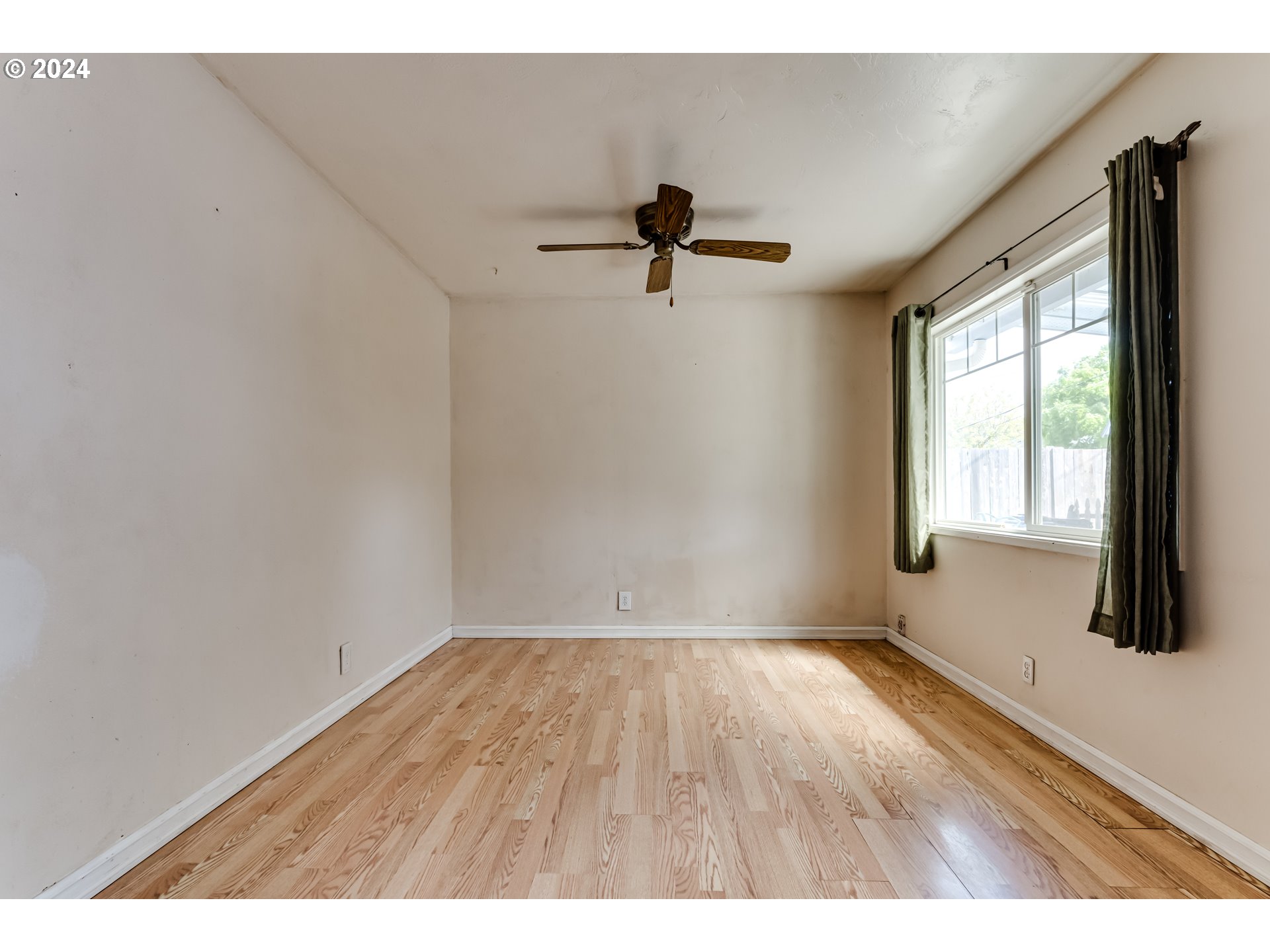 4115 Scottdale Street Eugene, OR 97404 - Photo 17 of 33 a view of room with a ceiling fan and window