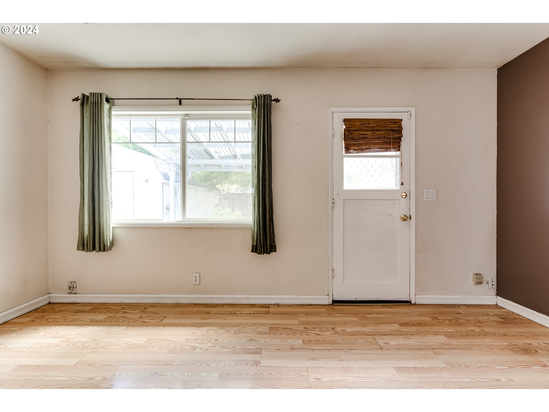 4115 Scottdale Street Eugene, OR 97404 - Photo 19 of 33 a view of an empty room with wooden floor and a window