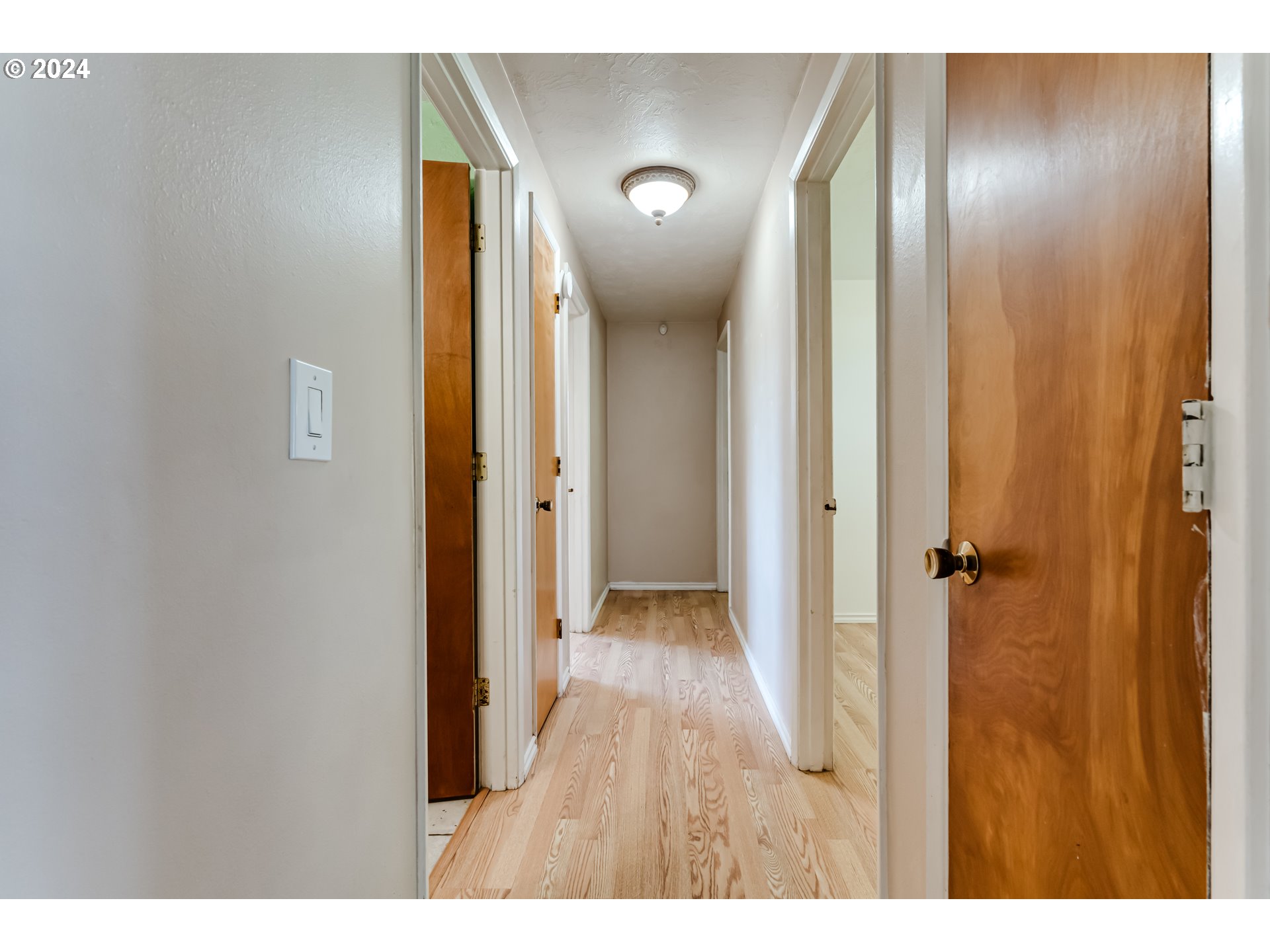4115 Scottdale Street Eugene, OR 97404 - Photo 20 of 33 a view of a hallway with wooden floor