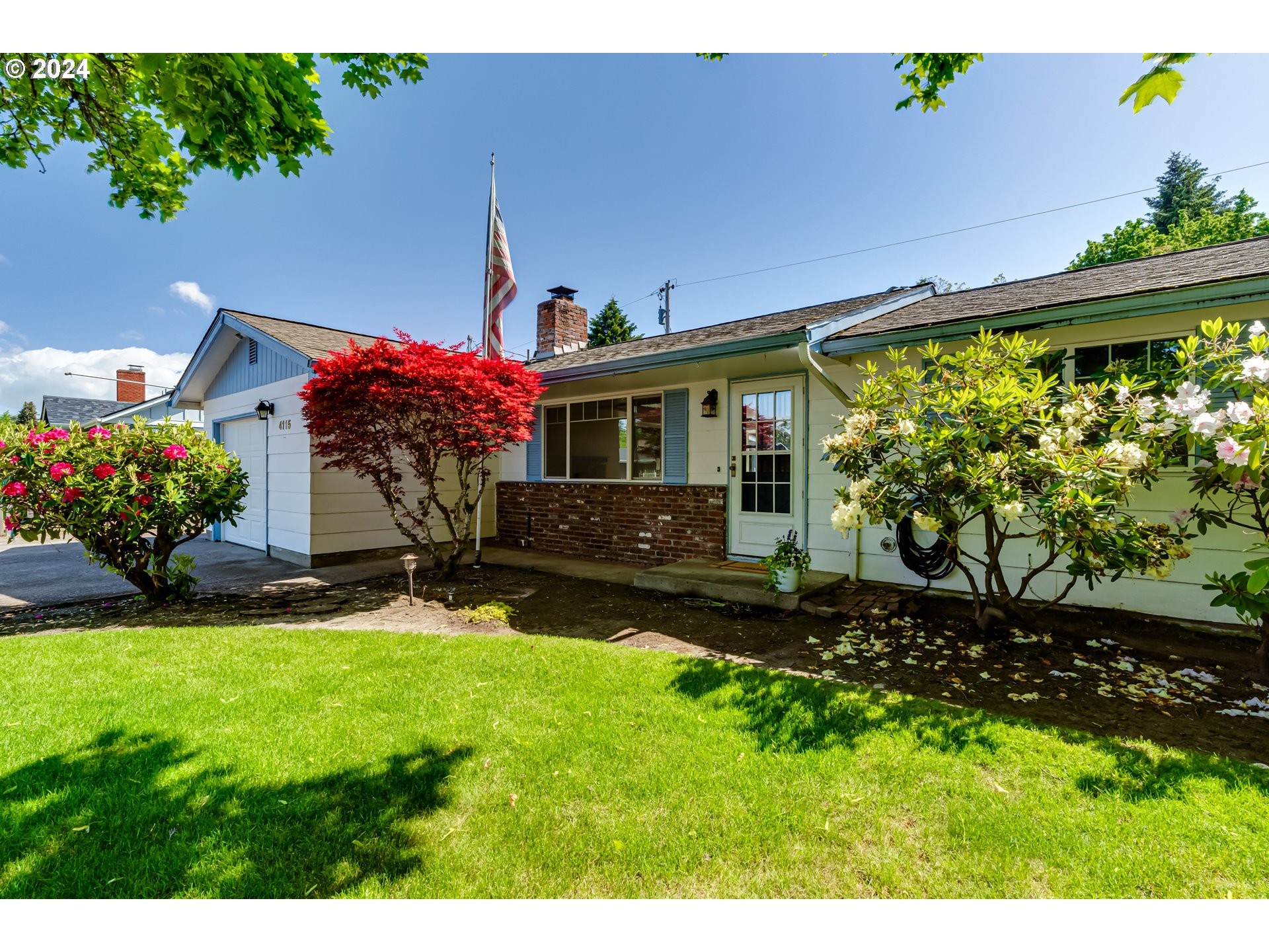 4115 Scottdale Street Eugene, OR 97404 - Photo 2 of 33 a front view of a house with a yard