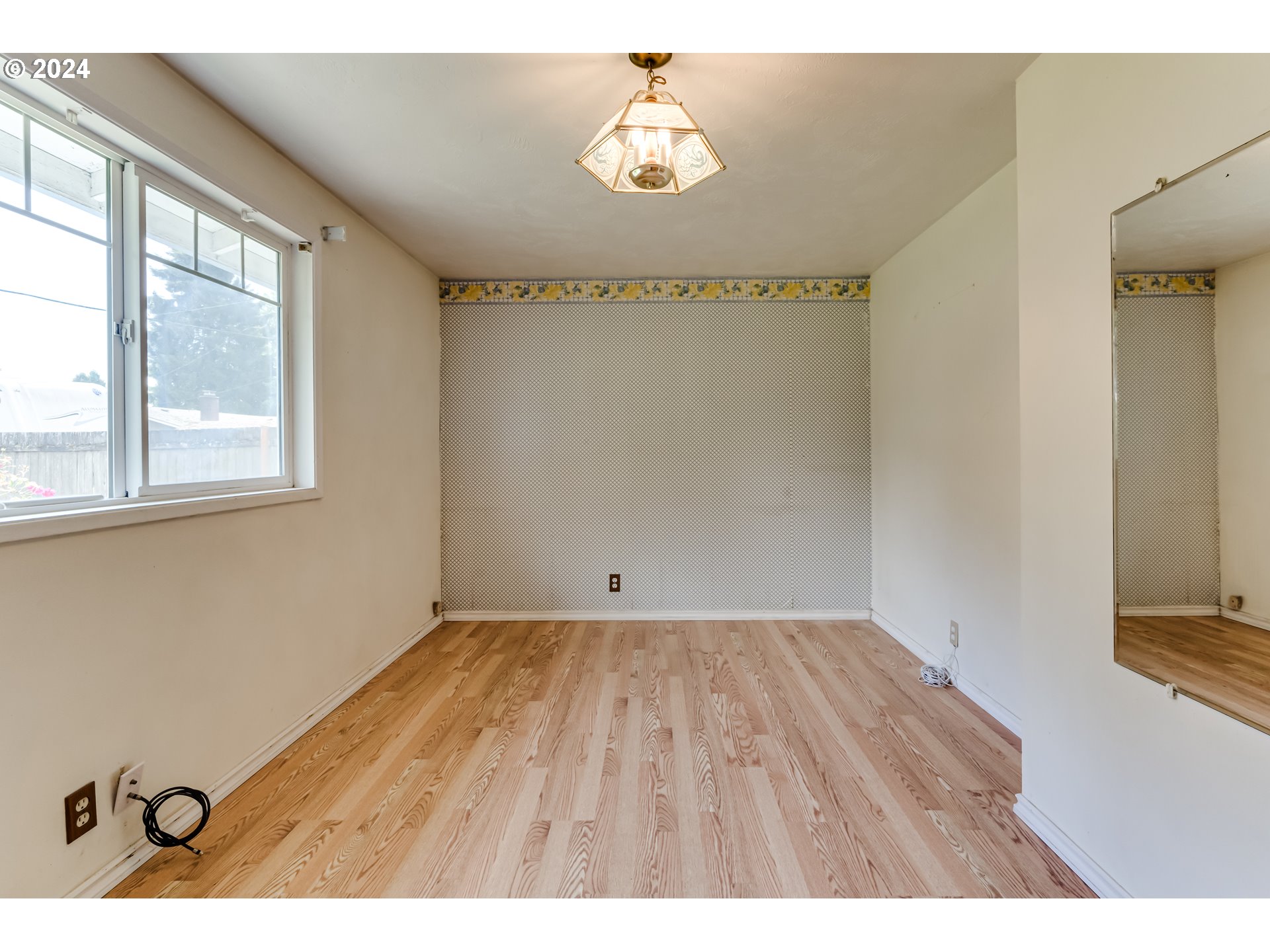 4115 Scottdale Street Eugene, OR 97404 - Photo 22 of 33 a view of empty room with wooden floor and fan