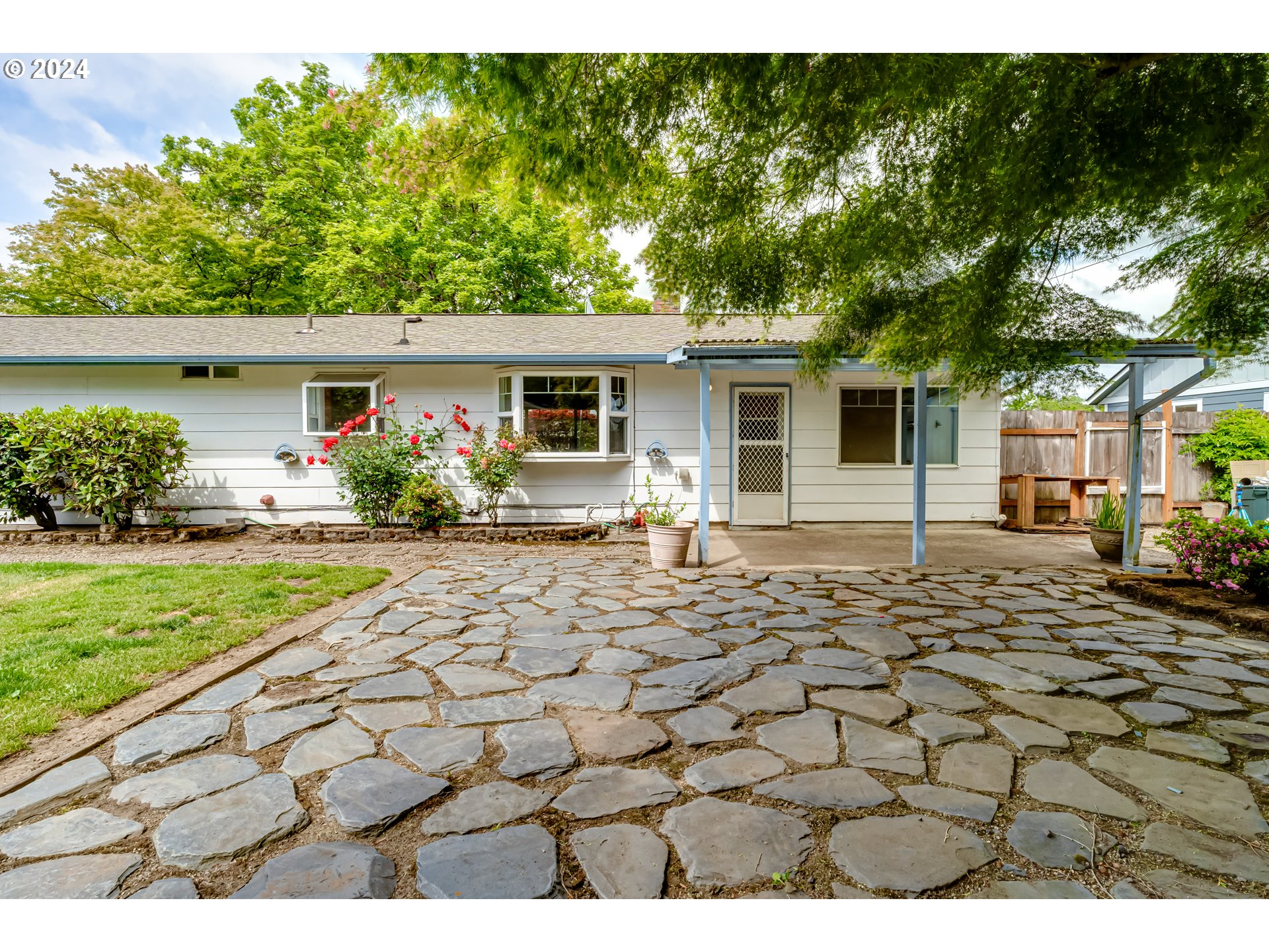 4115 Scottdale Street Eugene, OR 97404 - Photo 29 of 33 a front view of a house with garden