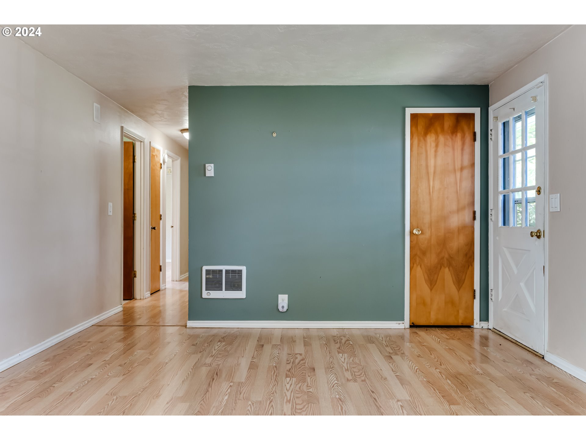 4115 Scottdale Street Eugene, OR 97404 - Photo 6 of 33 a view of an empty room with wooden floor and a window