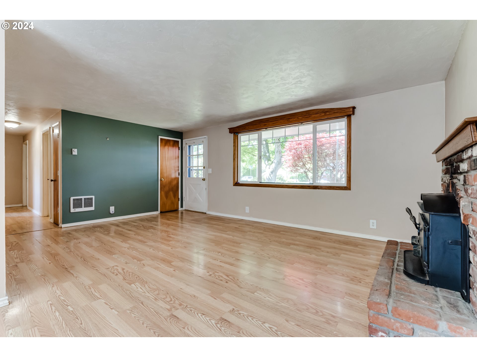 4115 Scottdale Street Eugene, OR 97404 - Photo 7 of 33 a view of empty room with wooden floor and fan