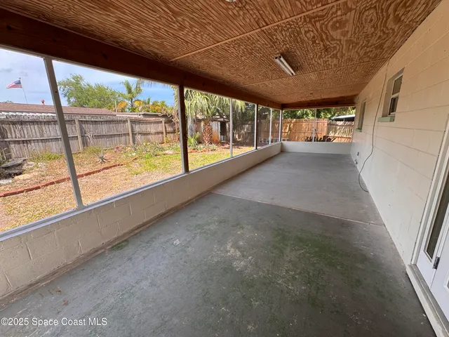 a view of a room with a large window