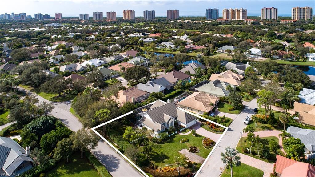 720 Turkey Oak Lane Naples, FL 34108 - Photo 3 of 31 an aerial view of residential houses with city view