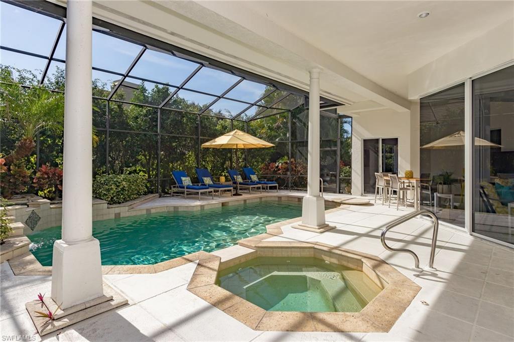 720 Turkey Oak Lane Naples, FL 34108 - Photo 31 of 31 a view of a swimming pool with a patio