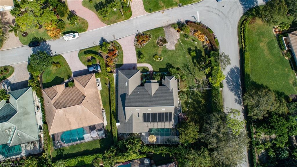 720 Turkey Oak Lane Naples, FL 34108 - Photo 6 of 31 an aerial view of a house with a yard and garden