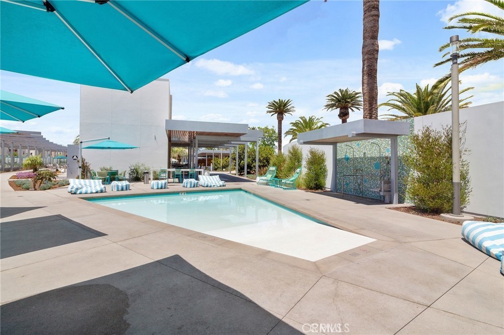 143 Frame Irvine, CA 92618 - Photo 40 of 41 a view of a patio with swimming pool table and chairs